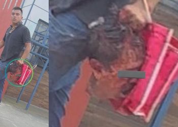 Hombre camina con una cabeza humana en Coatepec, Veracruz